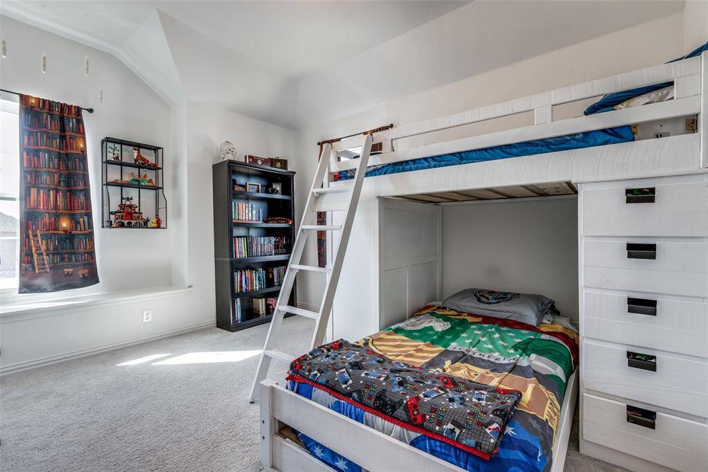 Carpeted bedroom with baseboards