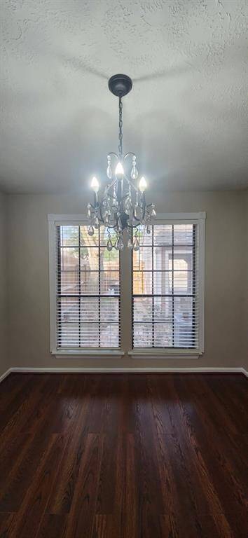 View of fenced in backyard from dining room