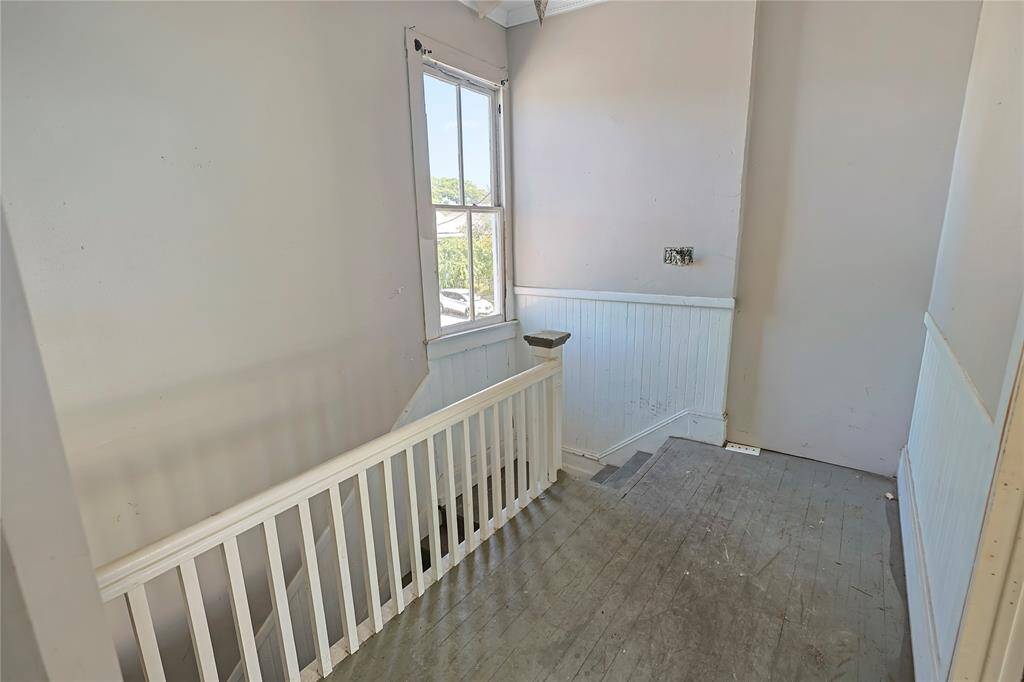 From the northside entry staircase, this landing area is a common space for separate units.