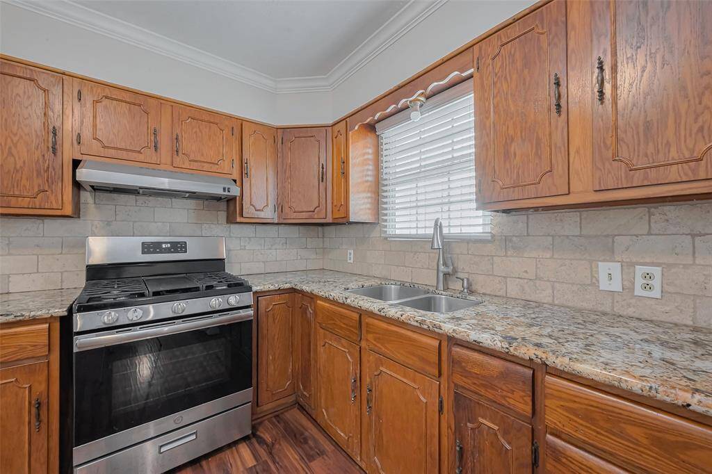 Thoughtfully designed with ample overhead and lower cabinetry, this kitchen provides generous storage space while maintaining a sleek, streamlined aesthetic.