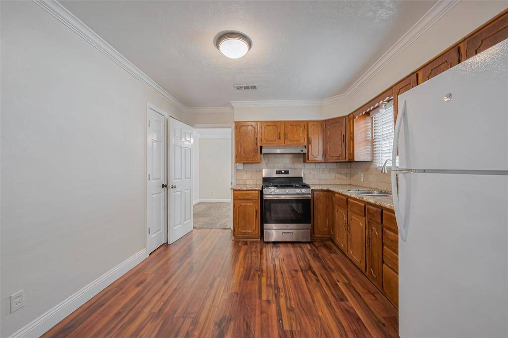 Spacious and well-organized, the kitchen features an efficient layout that maximizes functionality without compromising style.