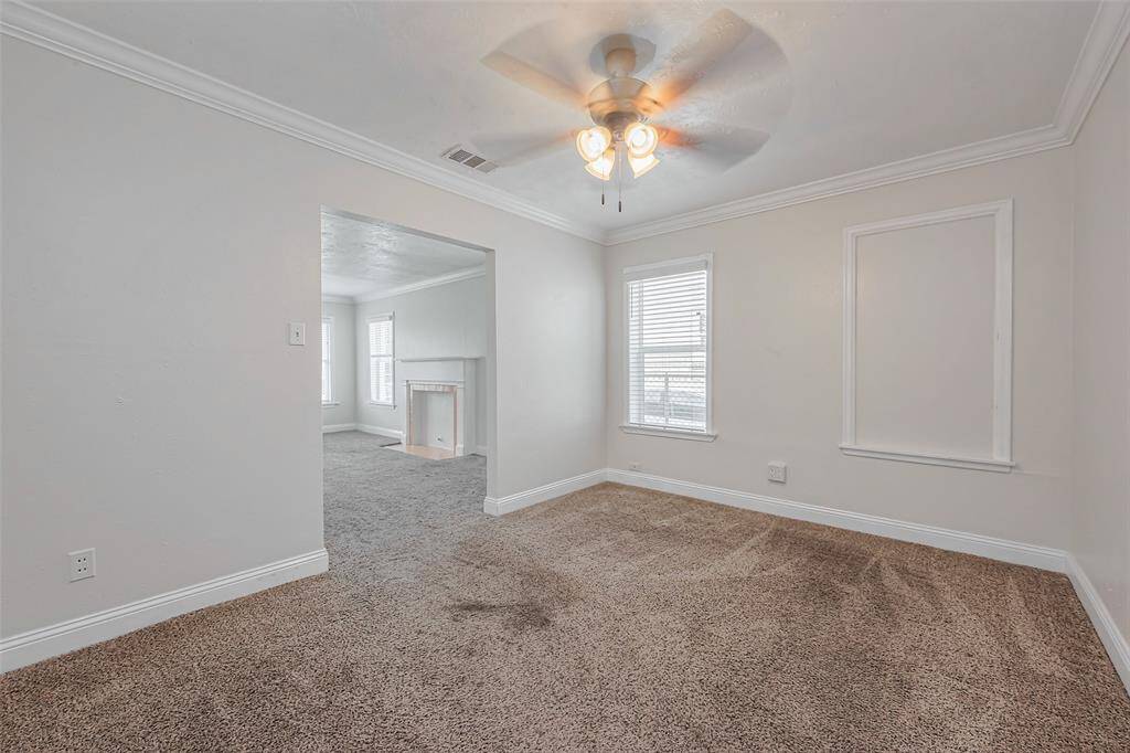 This transitional space, ideal for a formal dining area, maintains an open flow between the kitchen and living room.