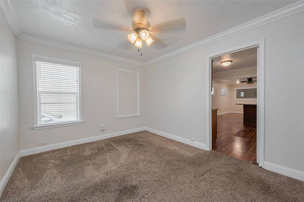 This designated dining area features a ceiling fan for added comfort and offers a central gathering spot within the home.