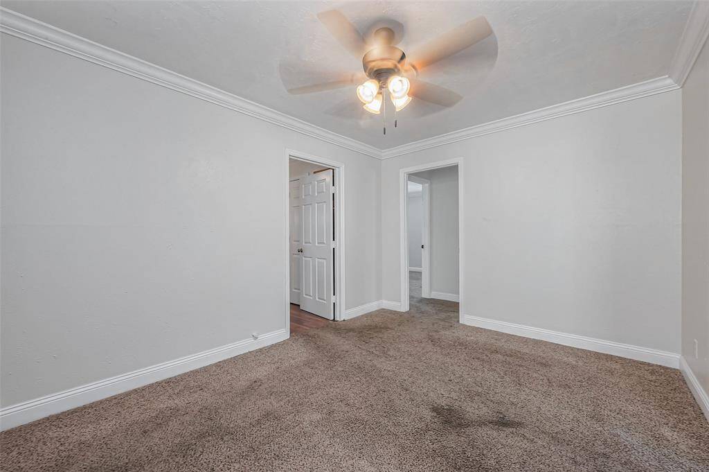 Centrally located, this dining space offers seamless flow with open access to the kitchen, living room, and adjacent rooms.