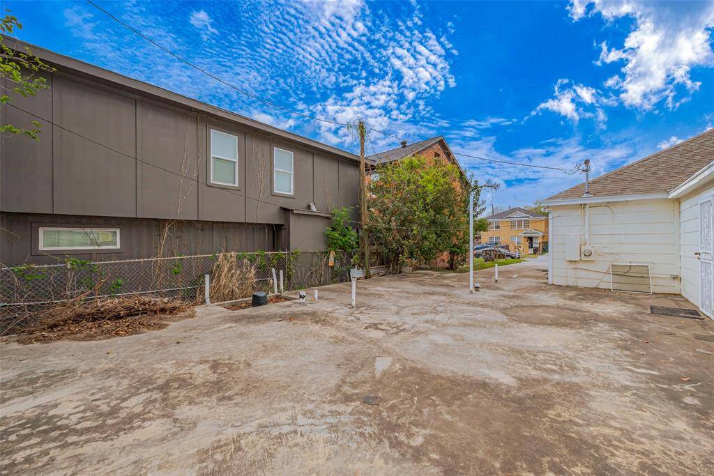 Another view of the slab area showcases its positioning relative to the neighboring property, providing insight into its size and placement.