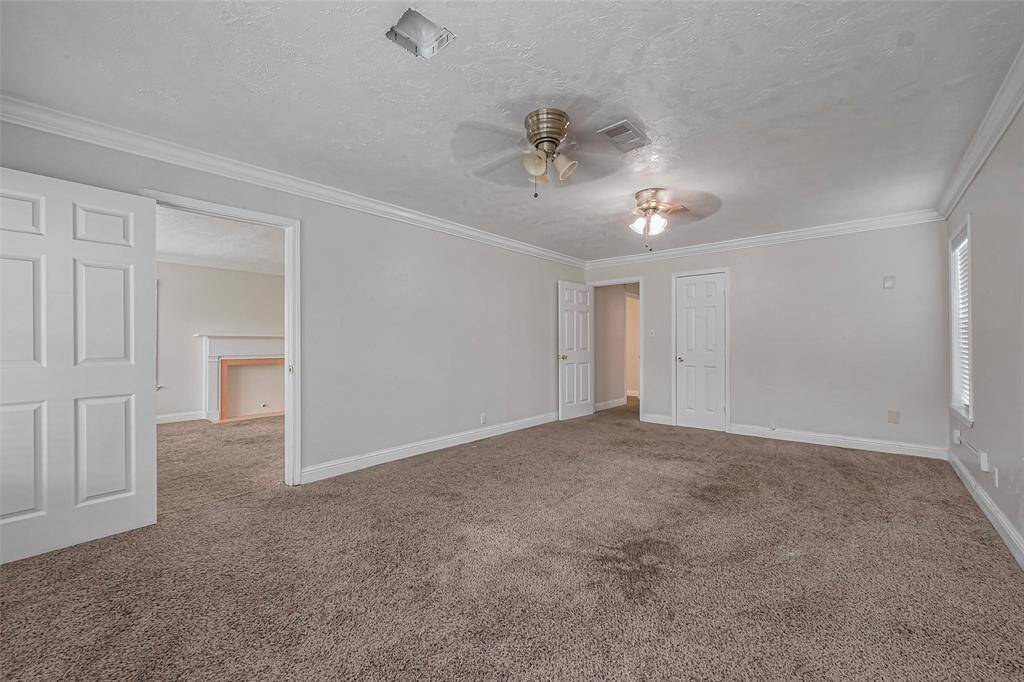 Equipped with two ceiling fans for optimal comfort, this bedroom also features direct access to the main living areas, adding both convenience and privacy.