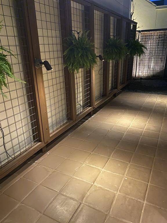 At dusk, just like in the large gorgeous front courtyard, custom landscape lighting comes alive - providing elegant views of the your thoughtful landscaped atrium like terrace! How will you use this space? Bonus outdoor space!