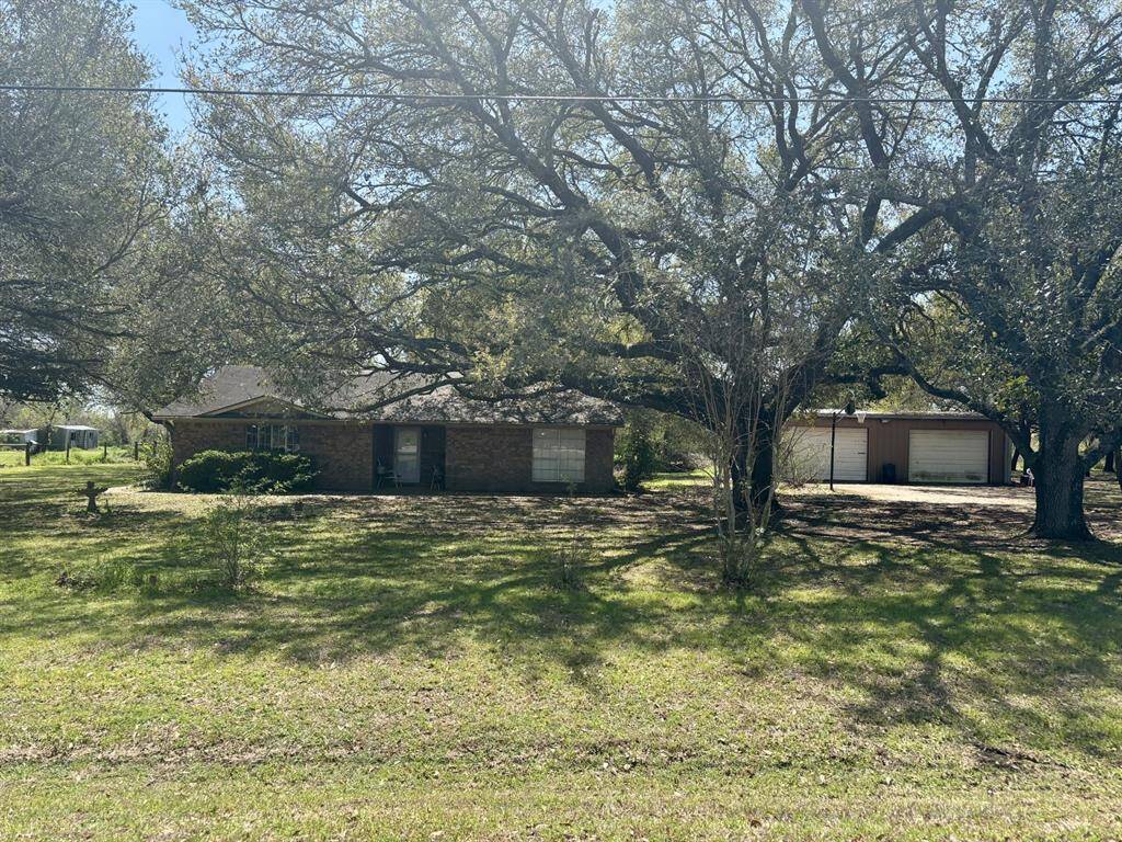 This 3 bedroom, 2 bath home is part of the sale.  It is 1,508 sq ft and the metal building is 850 sq ft.