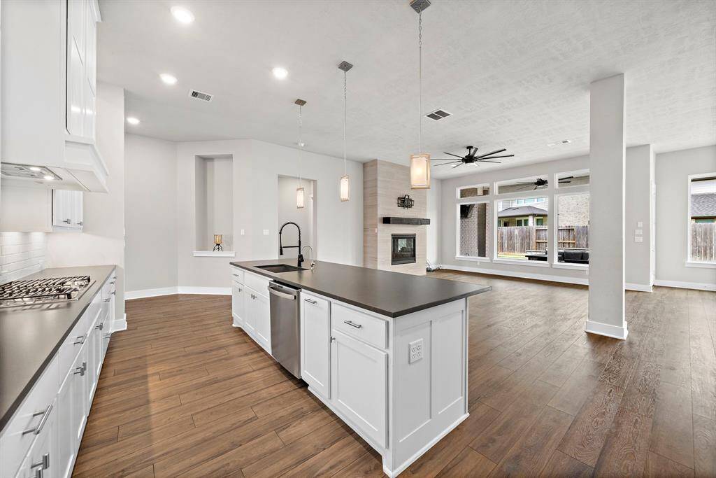 Featuring floor-to-ceiling cabinetry, this space offers an abundance of storage, ensuring everything has its place.