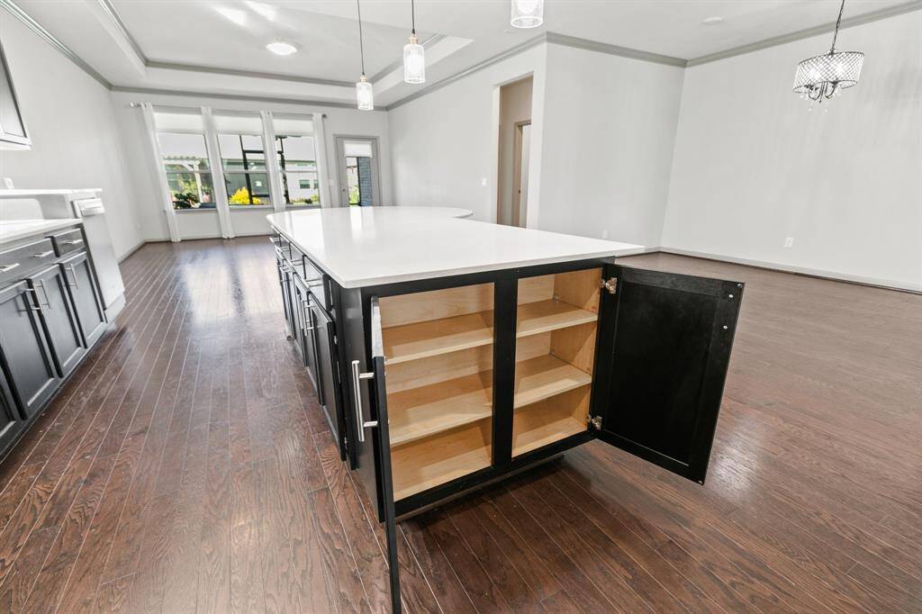 This extra storage space at the end of island is a nice spot for cookbooks and serving dishes.
