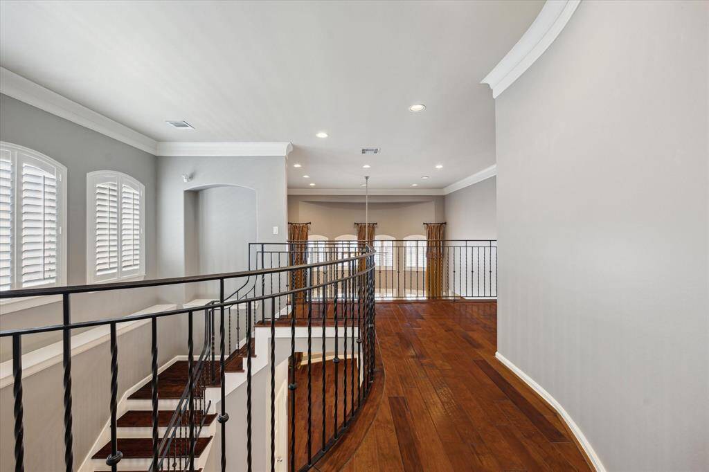Walkway from the primary bedroom to the rest of the 2nd floor.