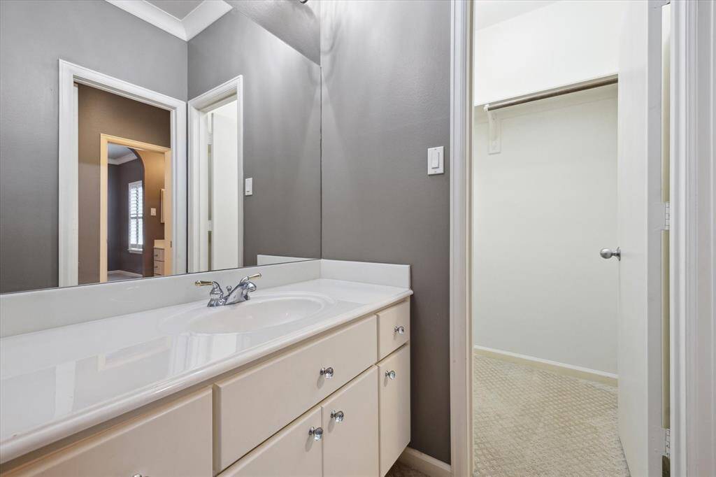 Picture of the sink with the walk-in closet in the background, the Jack and Jill bathroom is located to the right.
