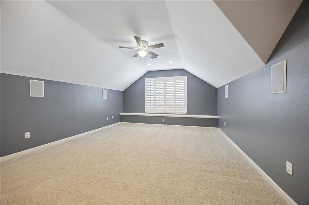 Third floor that can be used as a bedroom, media room, or playroom etc., with an en-suite bathroom, it is wired for a TV, has surround sound, and has a full bathroom with a walk-in closet.