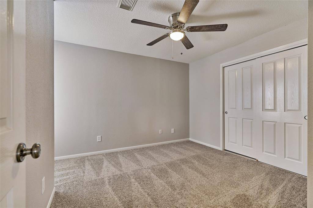 Bedroom 3 located on the second floor. New LED lighting, recent fan and neutral carpet.