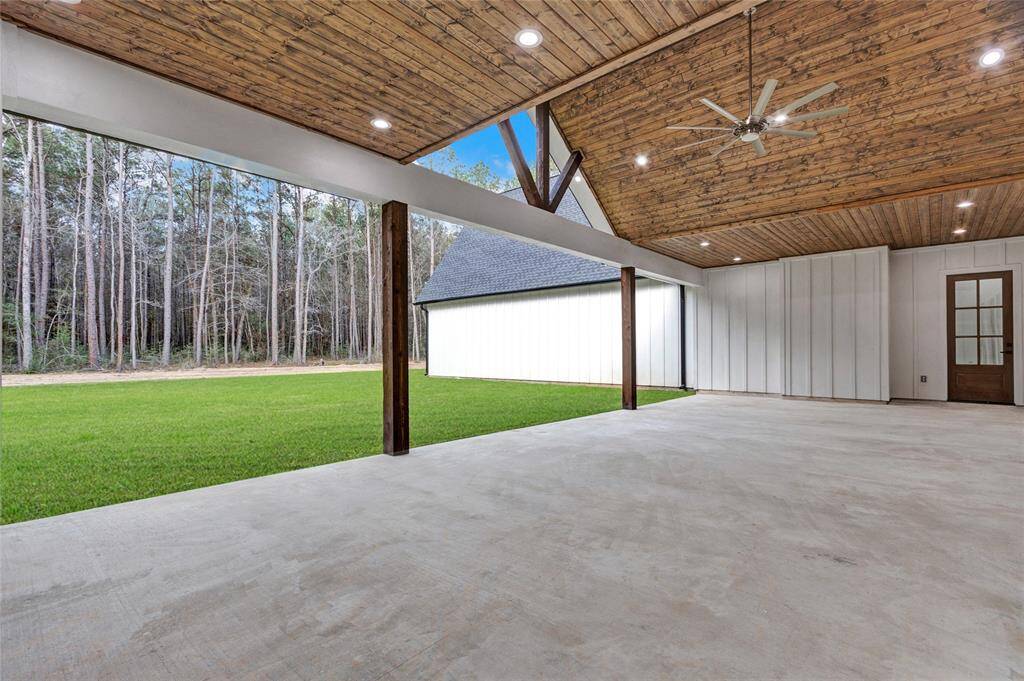 Wooded with winding driveway in the front for privacy.