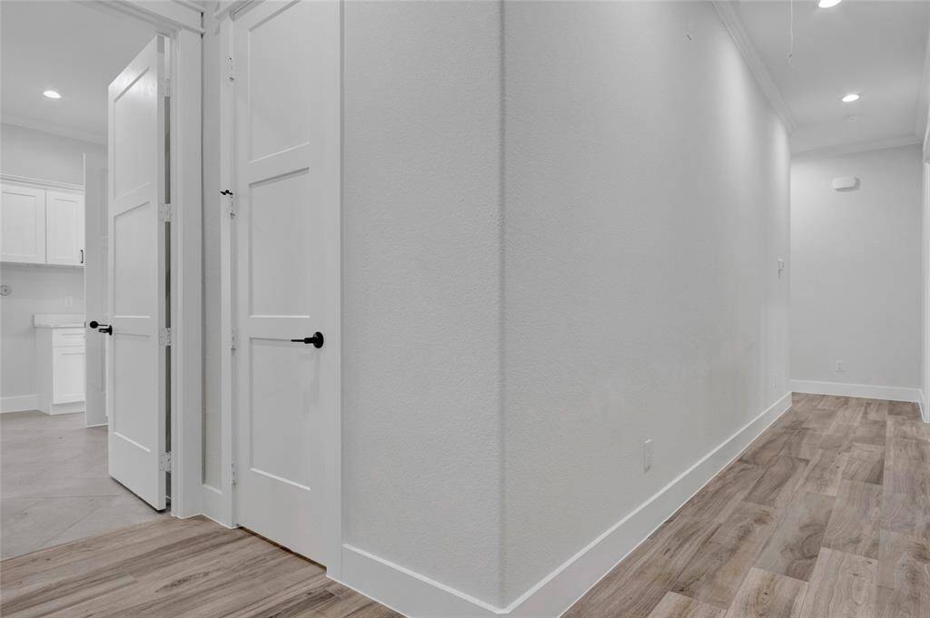 Half bath conveniently located close to garage and one of the back patio doors.