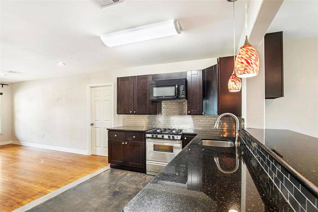 I see a pretty kitchen in your future! Elegant designer faucet and colorful pendant lighting!