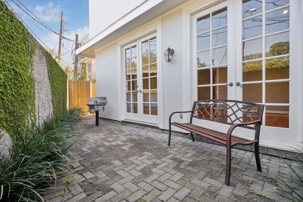 View of the brick paver BACKYARD- accessible from the Living Room dual doors and the Breakfast Room dual doors!