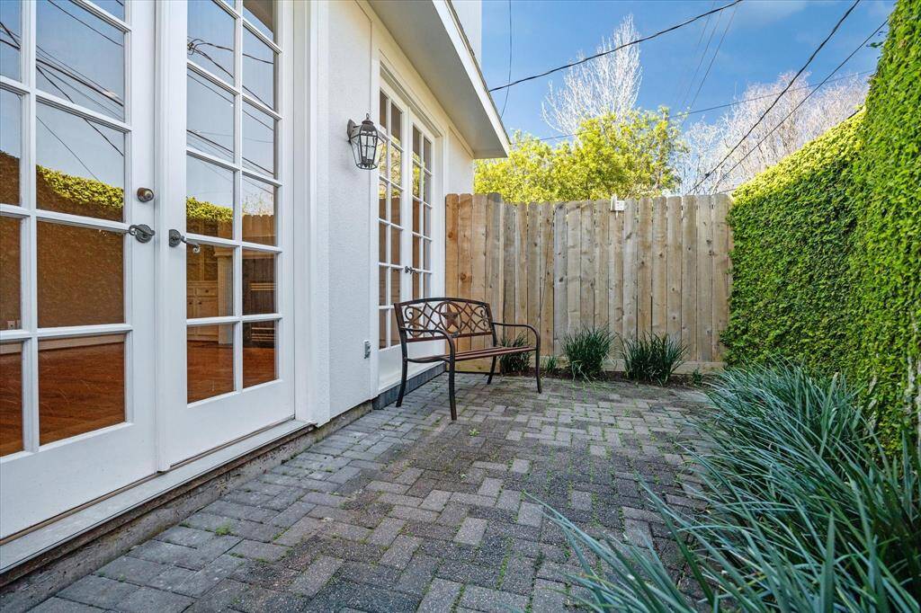 Another view of the BACKYARD showing its perimeter wood fencing with surrounding landscaping.