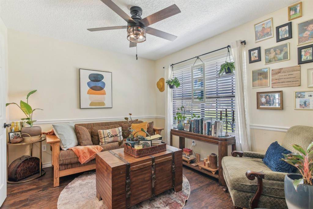 The room's layout offers a comfortable and versatile area for various uses.