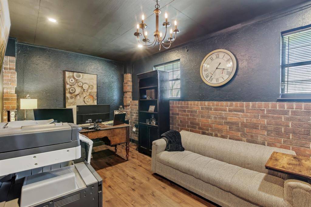Discover this fantastic office space; the contrasting wall treatments create a visual interest.