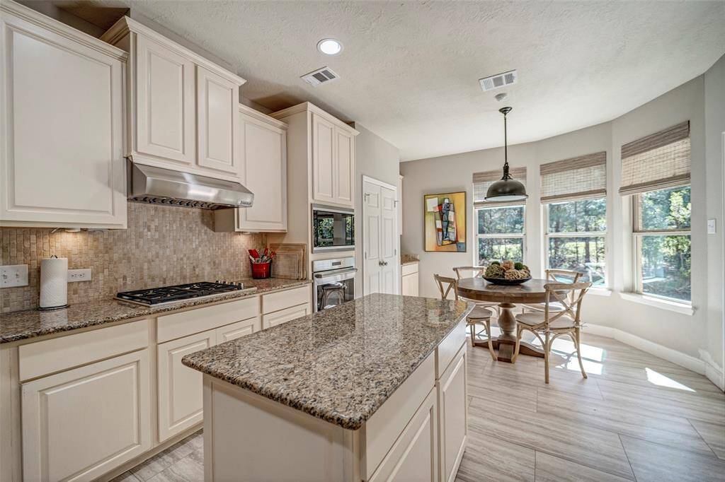 Floor to ceiling cabinets with SS appliances