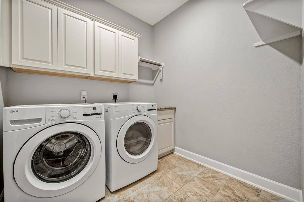 Large laundry room near garage entry