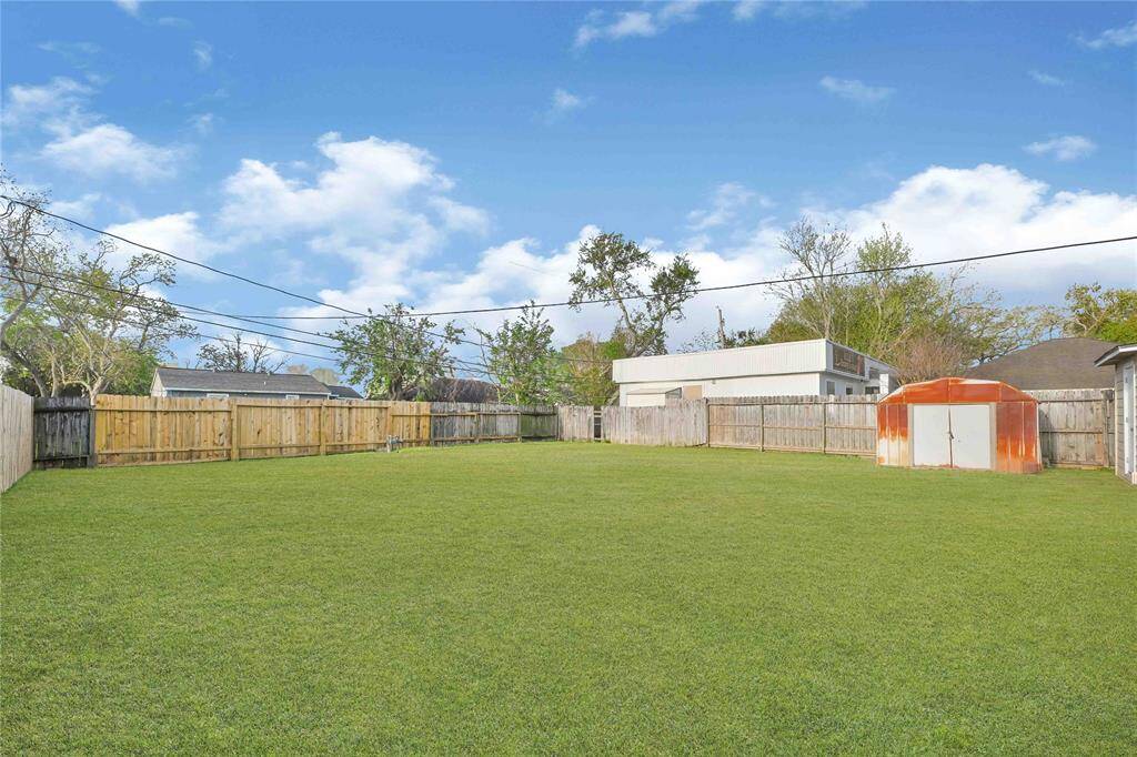 Huge fully fenced backyard offering plenty of space for outdoor activities, gardening, or relaxing.