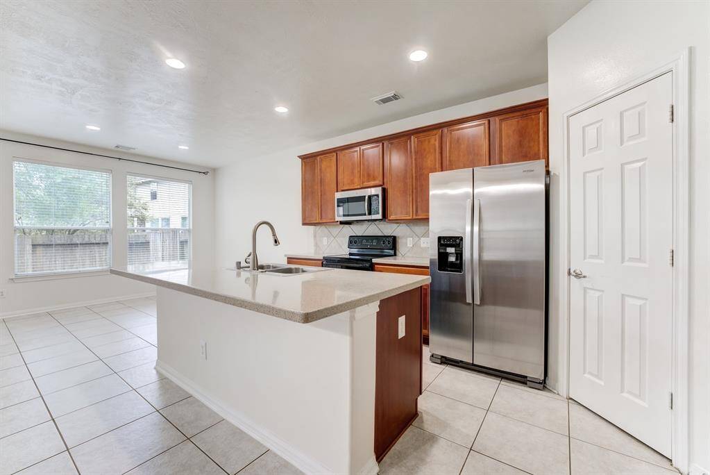 Beautiful Kitchen with brand new stainless steel refrigerator