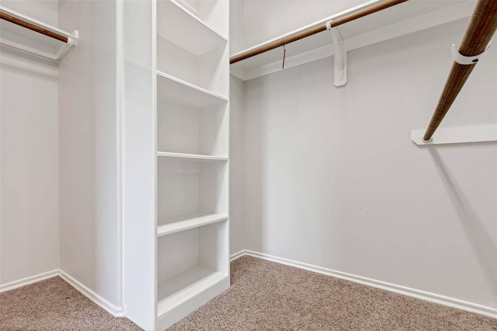 Primary closet next to the bathroom