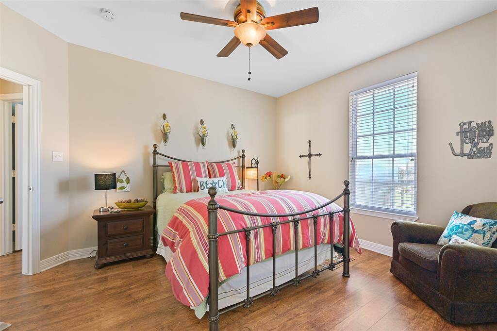 Spacious main-floor bedroom with a queen bed and generous closet.