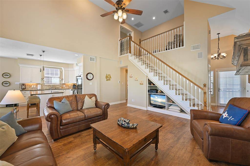 Experience the charm of a vaulted living room in a seamless open-concept layout.