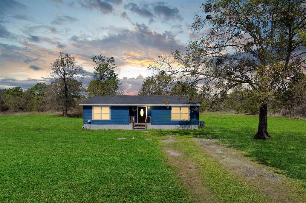 3 ACRES! POND! You are going to love this sweet country home with 3 Bedrooms and 2 Baths. The spacious open concept floor plan give you flexibility with the living areas to have a formal dining or a big family room. The kitchen has plenty of space to expand or be an eat in kitchen. There are 3 spacious bedrooms with large closets. Has a covered patio off the back of the home with views of the pond.