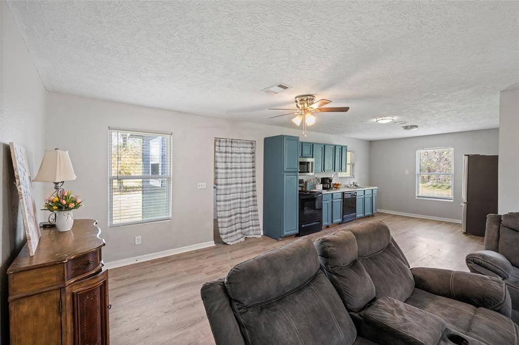 Laundry Room addition is behind the curtain off the kitchen. It measures approximately 8X8.