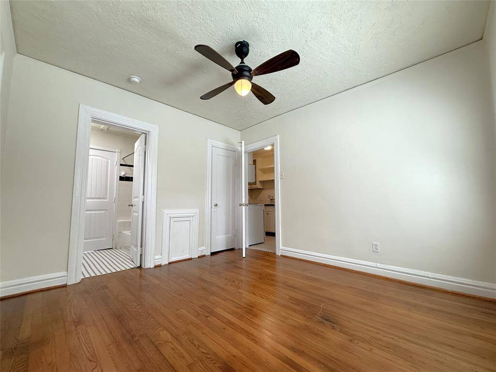 Entrance to the back bedroom is from the kitchen.