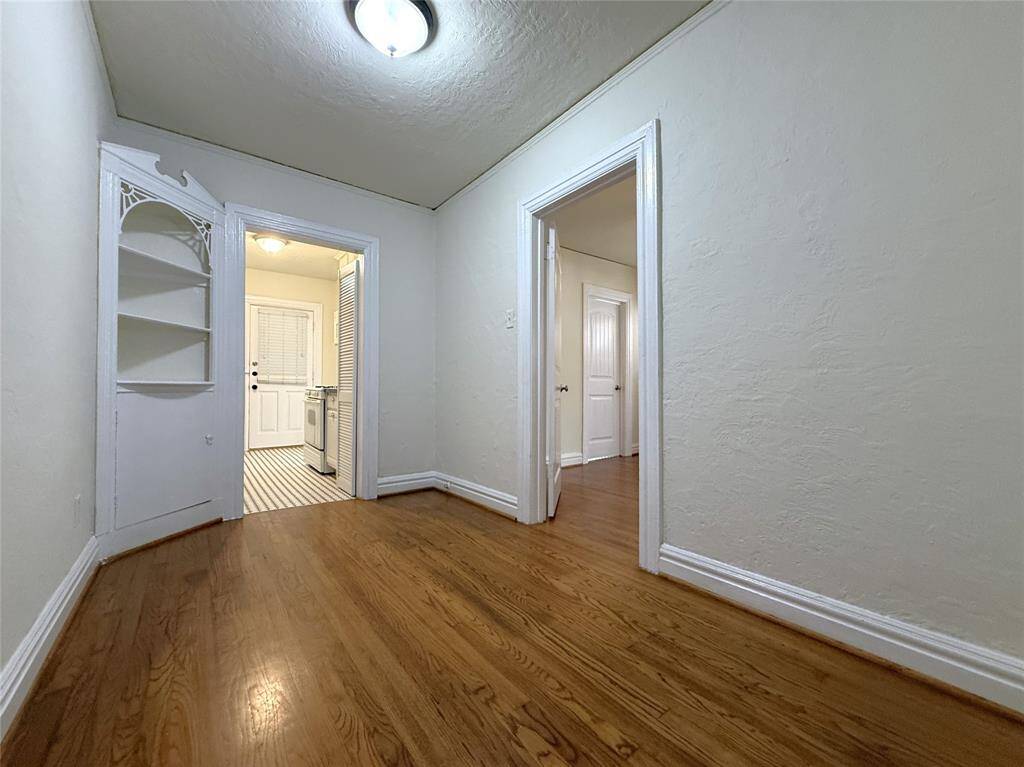 The dining room offers a built-in corner cupboard