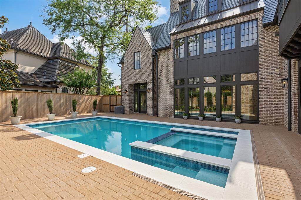 This expansive upper-level flex room offers endless versatility—perfect for a media lounge, playroom, home office, or creative studio. With dormer-style windows bringing in soft natural light and wide-plank wood floors throughout, the space is a blank canvas for your lifestyle.