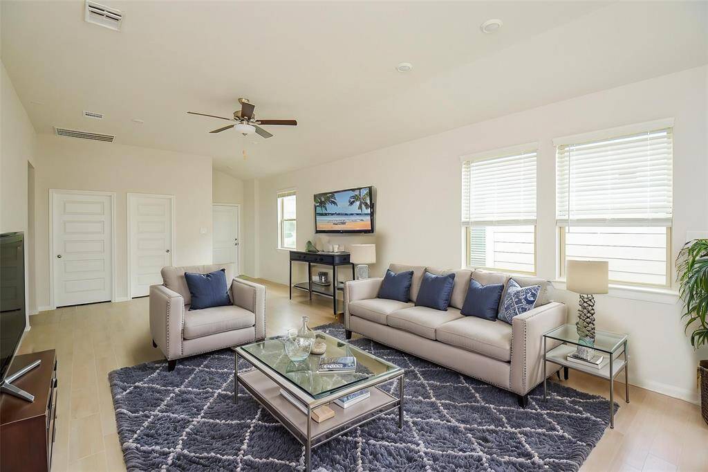 Large windows flood the space with sunlight, creating a warm and welcome atmosphere.