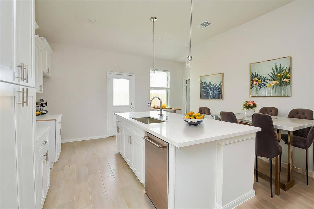 The kitchen island offers additional counter space and a casual seating area.