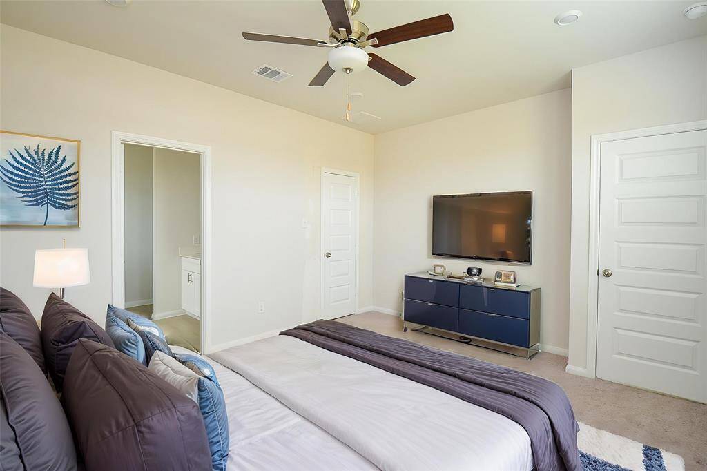 Discover this spacious closet for the primary bedroom.