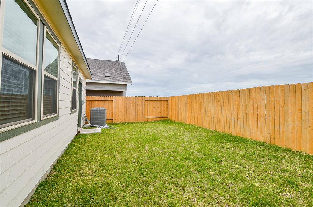 The well-maintained and lush green lawn is perfect for enjoying the outdoors.