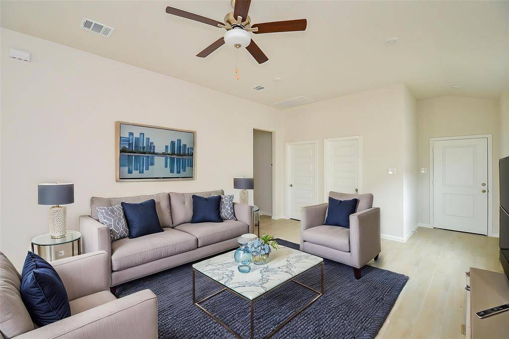 This expansive living area is the heart of the home.