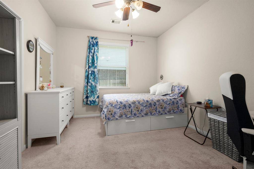 The second bedroom has plenty of space to study and sleep.