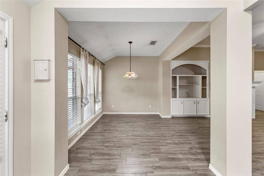 Generously sized dining room with access to patio.