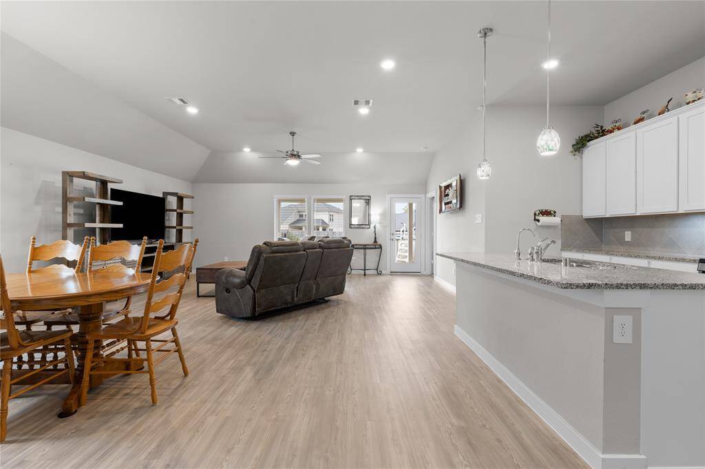 Kitchen opens up to family room and dining room; easy access to back patio