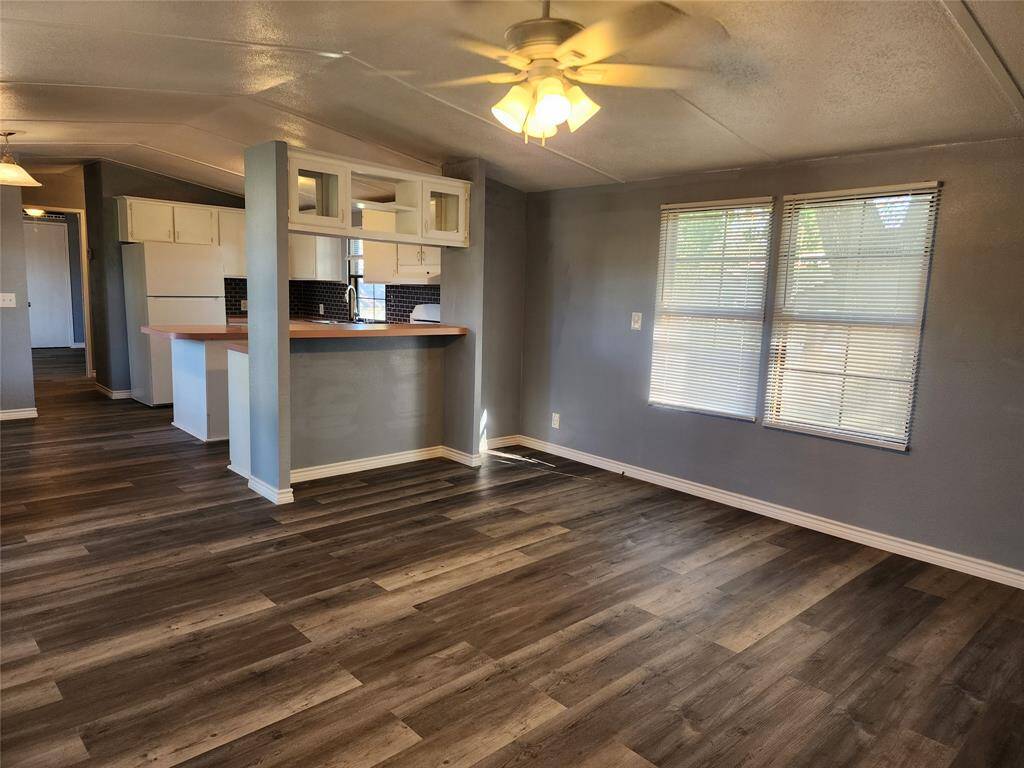 Living room is connected to the dining and kitchen area.