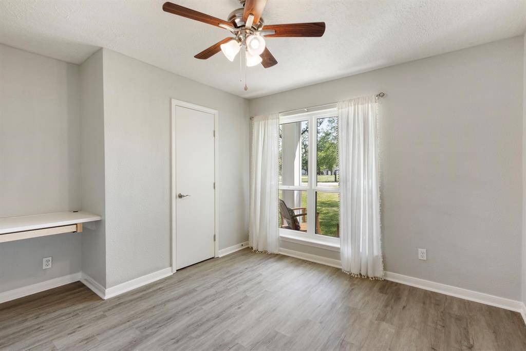 Secondary bedroom located off of living room near kitchen. Use it as a bedroom or make it into the perfect office!