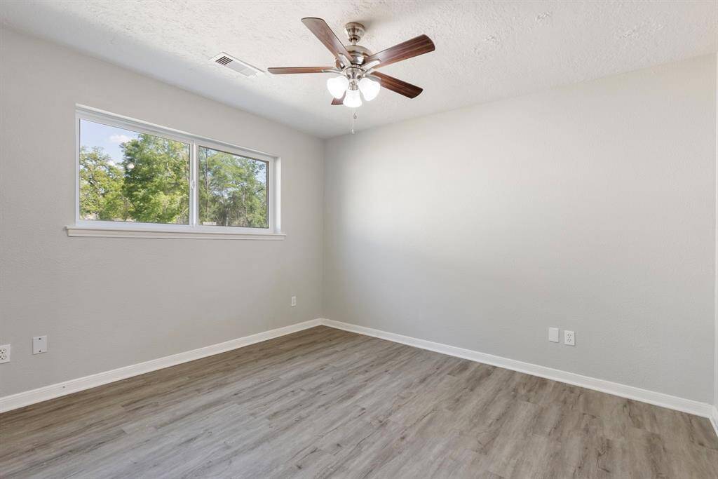 2nd Secondary bedroom at the back of the home. Window overlooks the backyard.