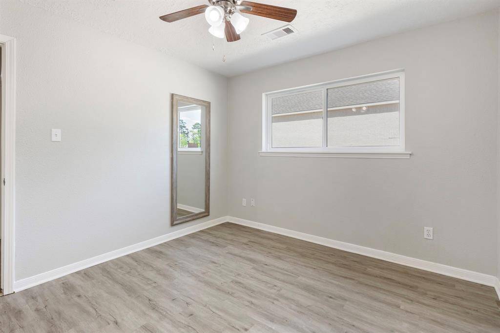 3rd Secondary bedroom located to the right of the living room. It features a secret closet!
