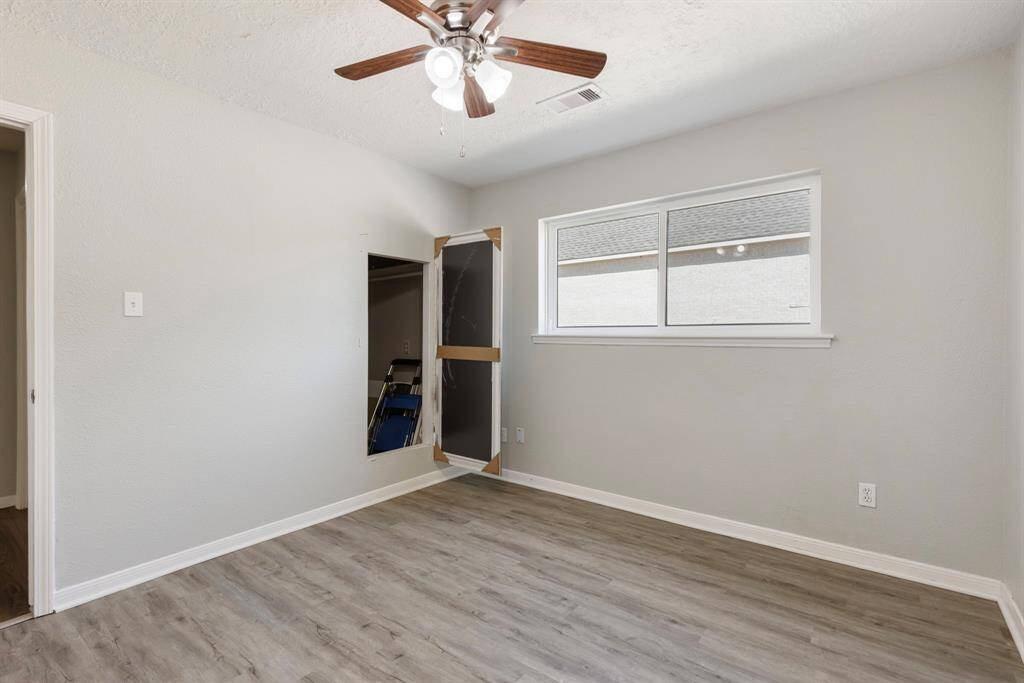 3rd Secondary bedroom located to the right of the living room. It features a secret closet!